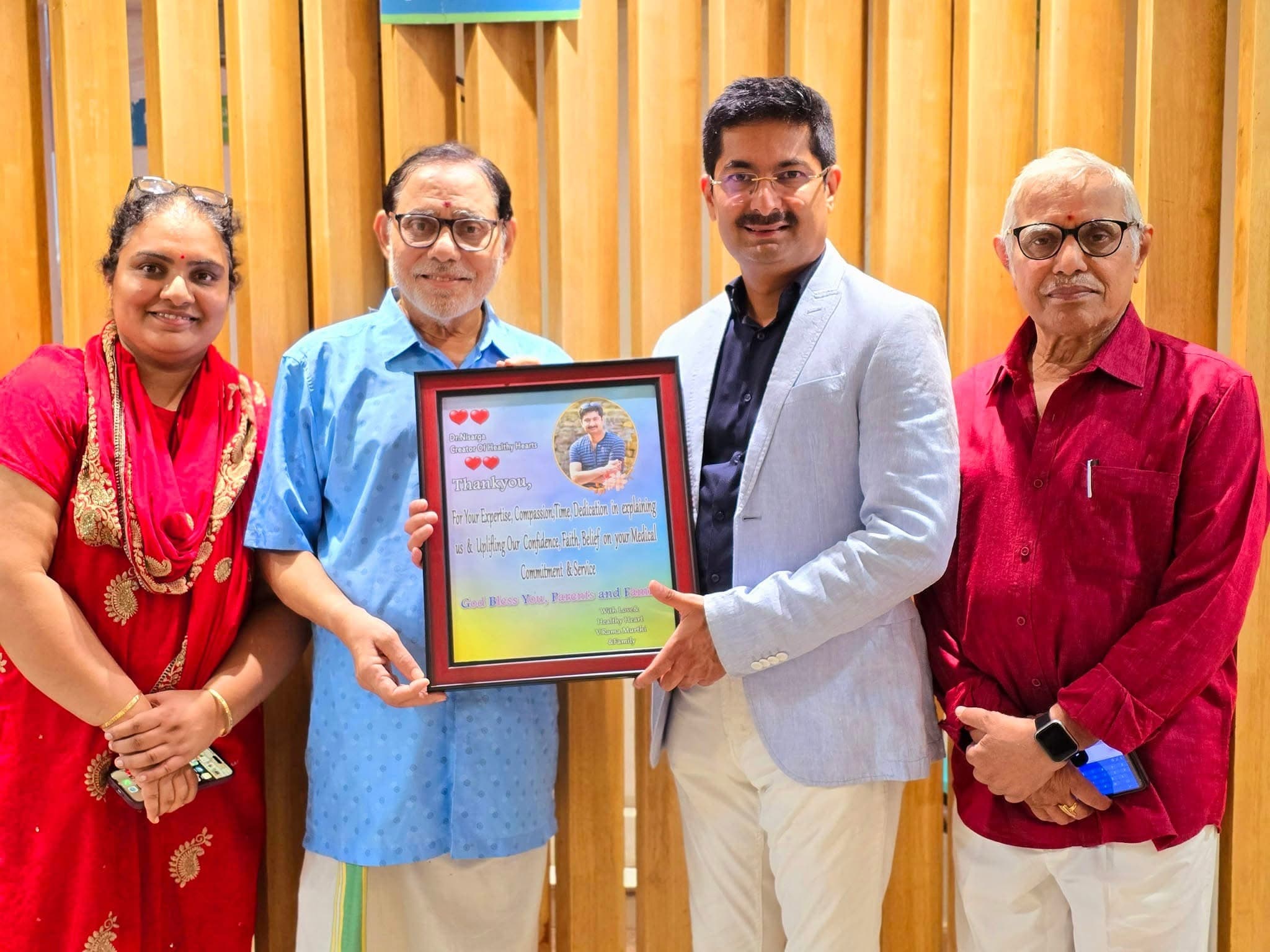 Dr. Nisarga receiving recognition for surgical excellence
