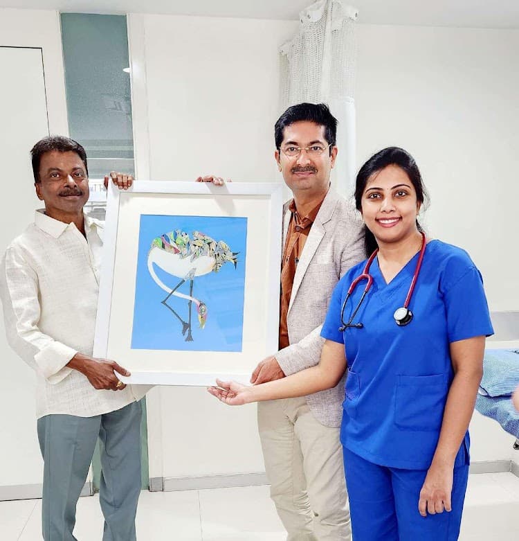 Dr. Nisarga with patient after surgery