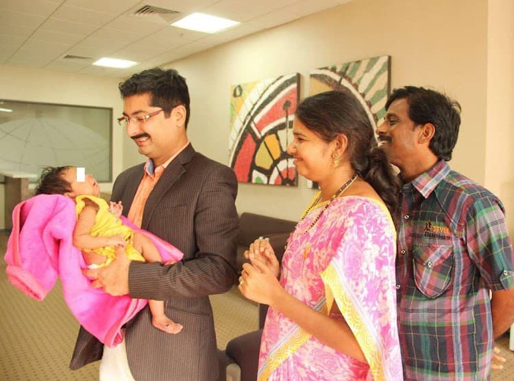 Dr. Nisarga with patient and family